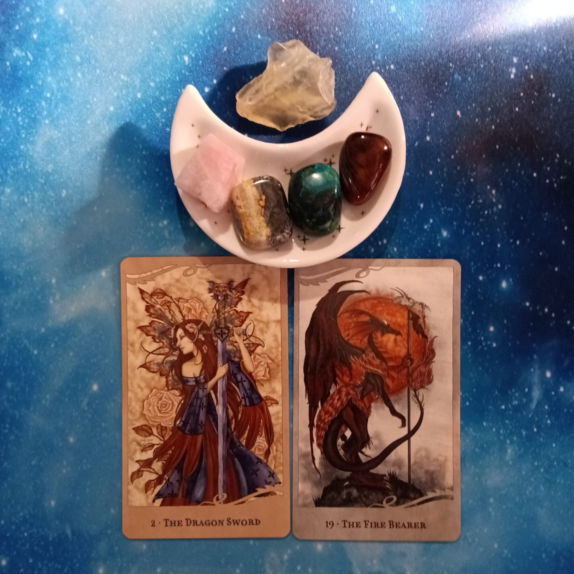 Live and Speak Your Truth ~ A Message From the Universe, For the Love of Dragons Oracle cards, 2 oracle cards and crystals on a starry blue background