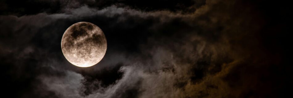 Full Moon Tarotscope for December 2024 - Image of a full moon in a partially cloudy sky