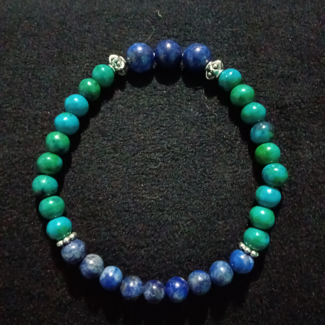 Bracelet with blue and green stones on a black background
