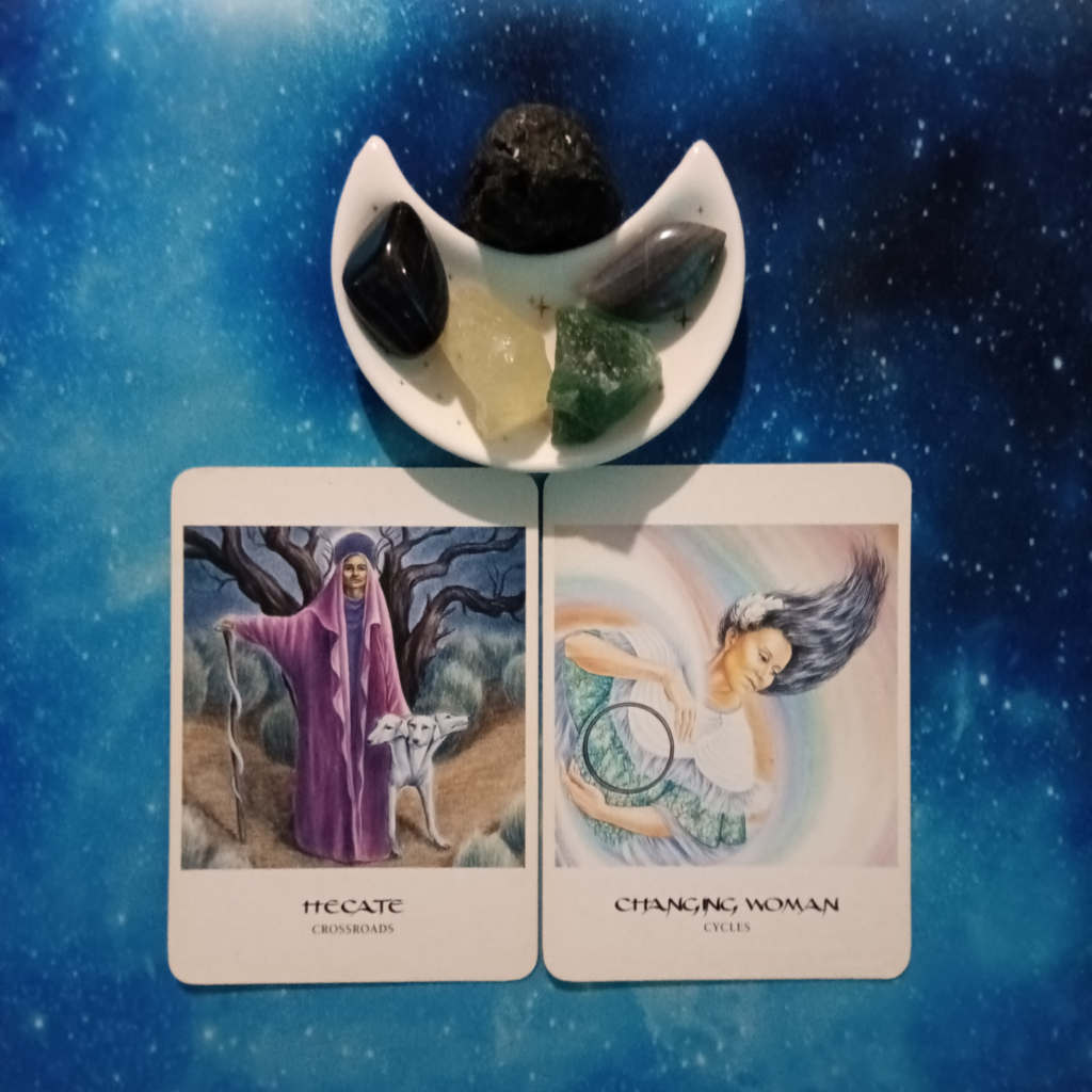 Ride the Wave of Change ~ A Message From the Universe, 2 Goddess Oracle cards and crystals on a starry blue background