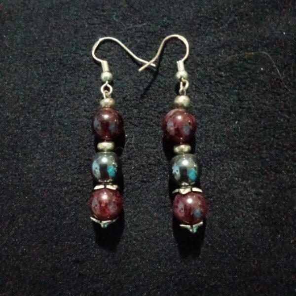Grounded Flow: Garnet & Hematite Earrings for Stability & Change, A pair of handmade earrings featuring dark red Garnet beads and dark gray Hematite beads, with 925 silver hooks.