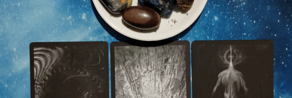 Abundance All Around You ~ A Message From the Universe, Black Tarot cards and crystals on a starry blue background
