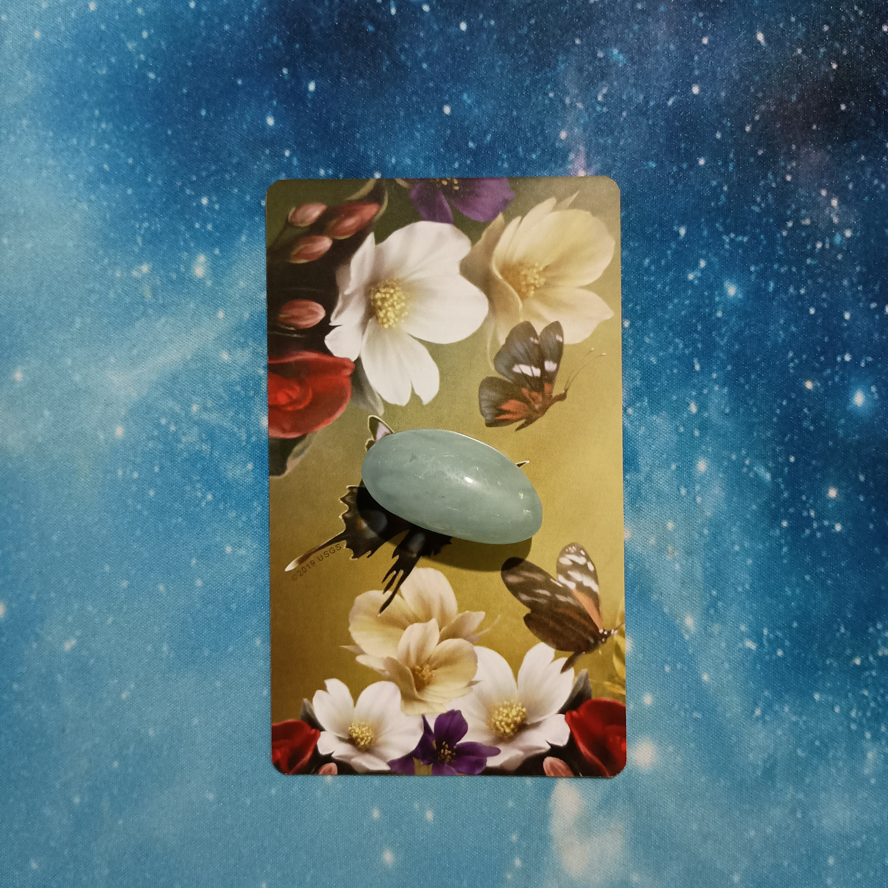 Full Moon Pick-a-Card Tarot Reading for June 2025, Pile 2, Aquamarine crystal on 1 Elle Qui oracle card, face down