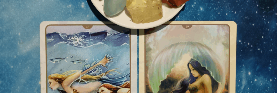 Care for Our Mother Earth ~ A Message From the Universe, two Oracle of the Mermaids cards and crystals on a starry blue background