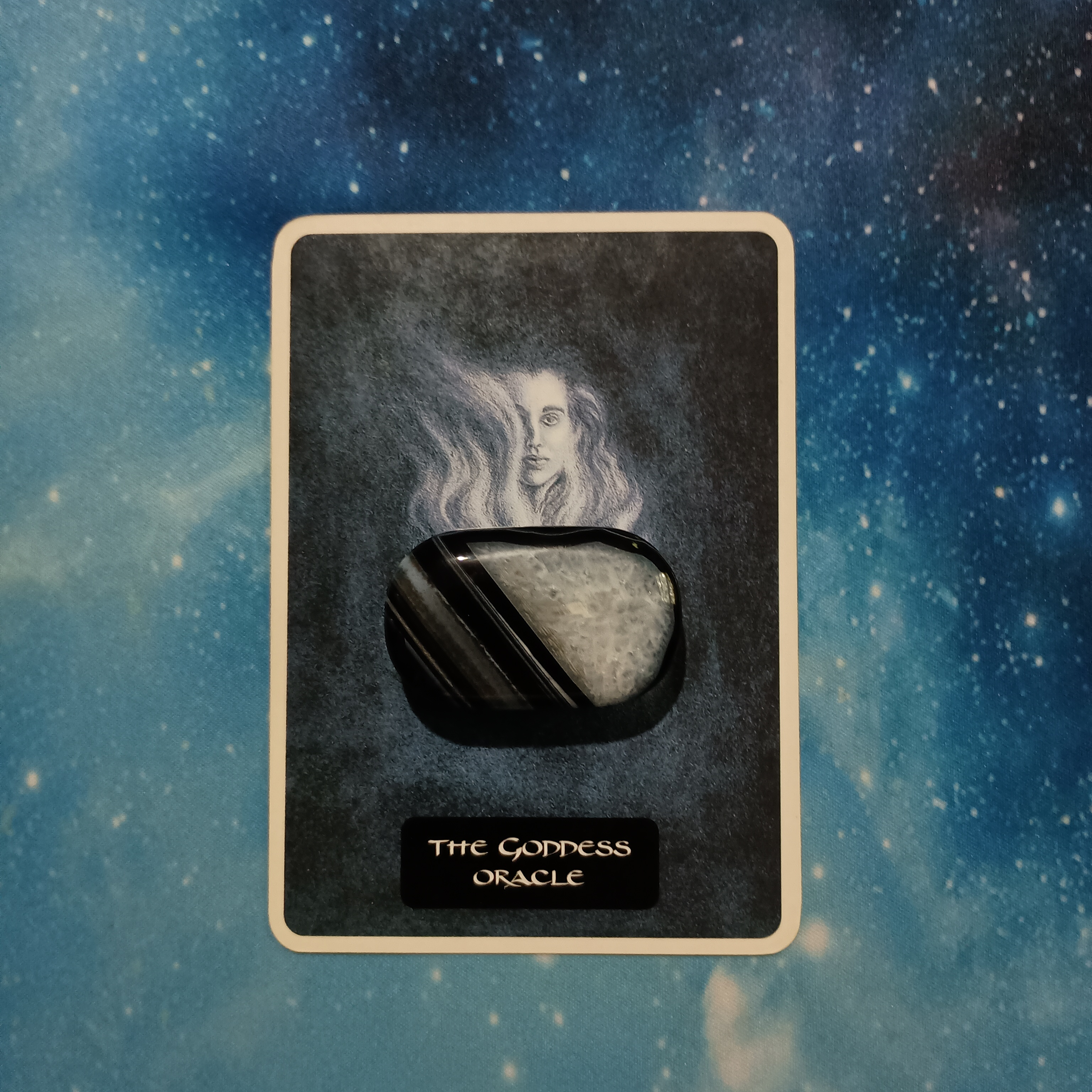 Full Moon Pick-a-Card Tarot Reading for July 2025, Pile 4, Black Agate crystal on 1 oracle card, face down