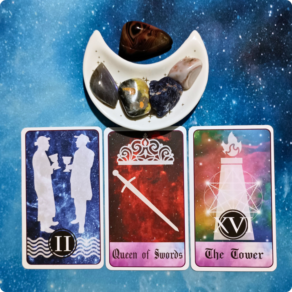 A Difficult Conversation or Task ~ A Message From the Universe, 3 Celestial Tarot cards and crystals on a starry blue background