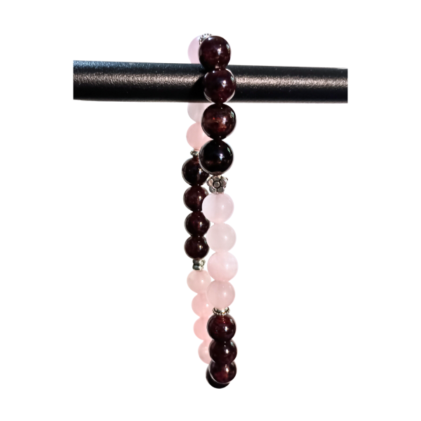 Cosmic Connection Rose Quartz & Garnet Bracelet for Unconditional Love, hanging from display, white bkg