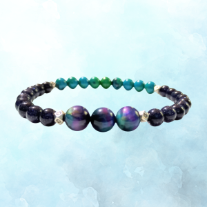 Cosmic Spark: Blue Goldstone, Malachite, Azurite, & Tiger's Eye Bracelet for Creation & Manifestation, ft image, side view, blue background