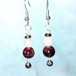 Cosmic Connection Garnet & Rose Quartz Earrings, ft image, hanging, blue BKG