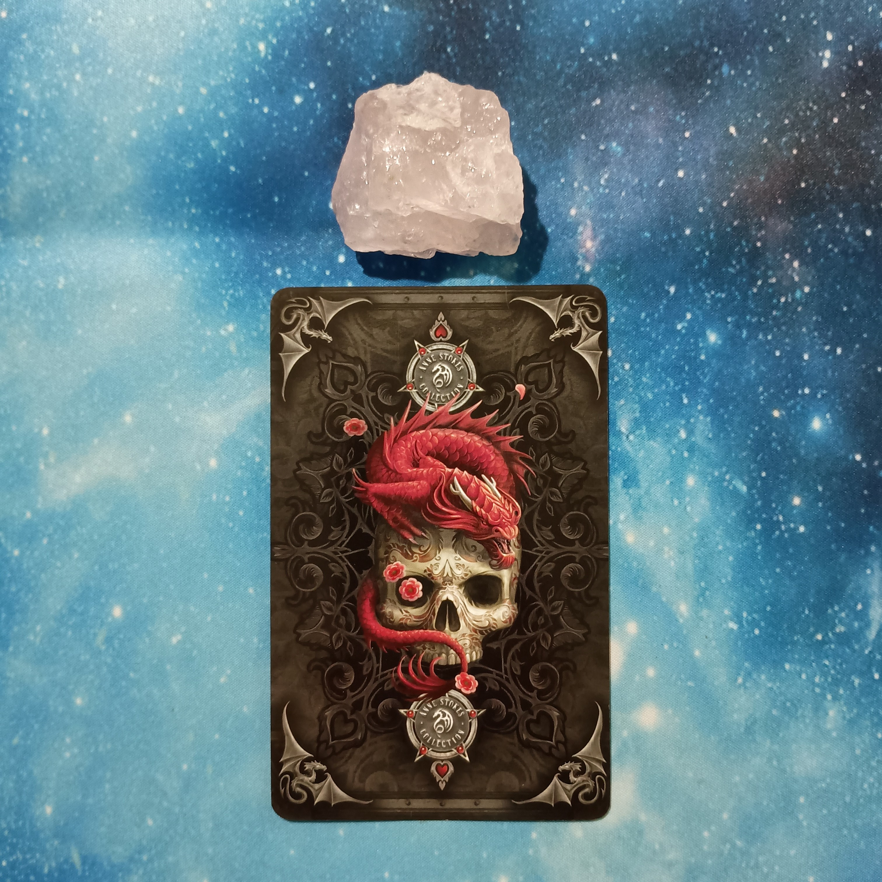 Full Moon Magic: Your August 2025 Pick-a-Card Tarot Reading, Pile 1, Rose Quartz crystal on a starry blue background, and 1 oracle card, face down