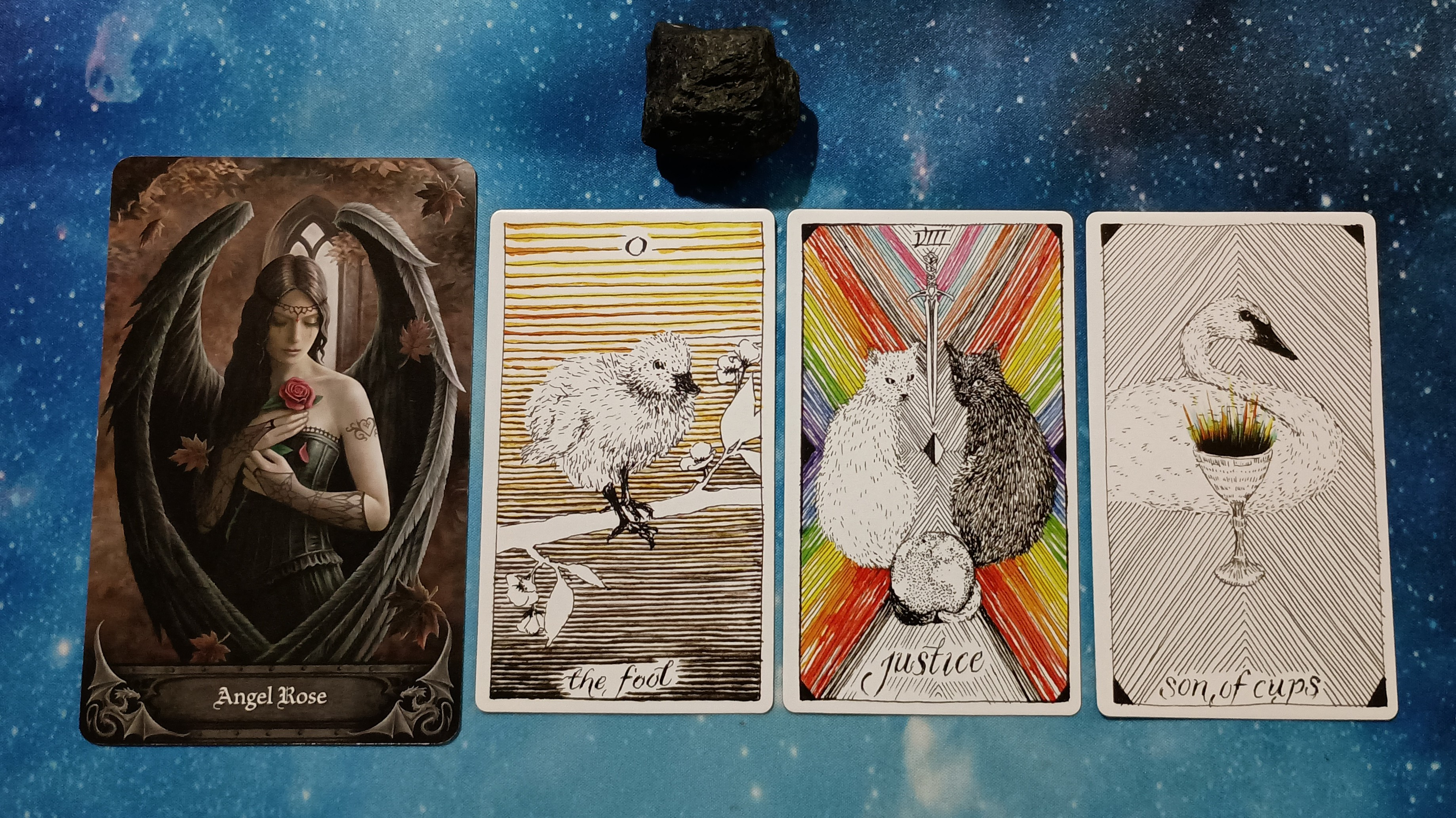 Full Moon Magic: Your August 2025 Pick-a-Card Tarot Reading, Pile 3, Black Tourmaline crystal and 4 cards, face up
