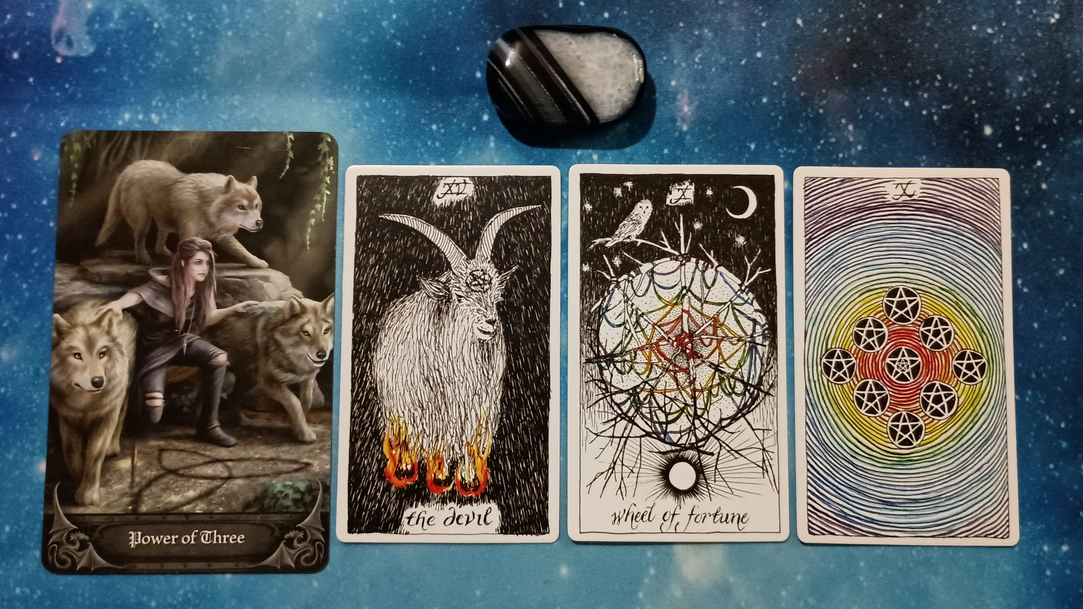 Full Moon Magic: Your August 2025 Pick-a-Card Tarot Reading, Pile 4, Black Agate crystal, and 4 cards, face up