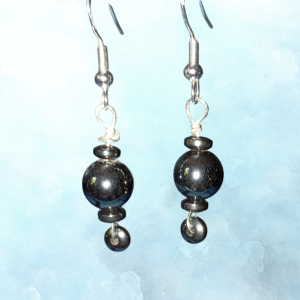 Inner Anchor Hematite Earrings for Protection and Grounding, hanging, blue BKG