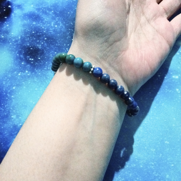 Intuitive Expression Azurite, Malachite, Sodalite & Lapis Lazuli Bracelet, wrist under view, blue background