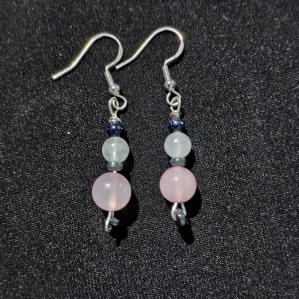 Radiant Heart Rose Quartz & Clear Quartz Earrings, flat lay, black BKG