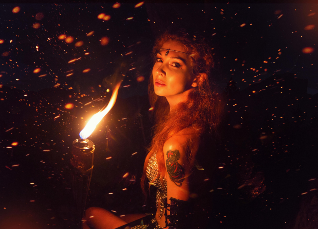 I'm A Hot Mess, Here's Why And What's Up! Photo by Alice AliNari on Pexels.com, tattooed woman holding torch, spiritual activism and change