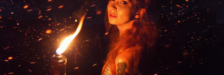 I'm A Hot Mess, Here's Why And What's Up! Photo by Alice AliNari on Pexels.com, tattooed woman holding torch, spiritual activism and change