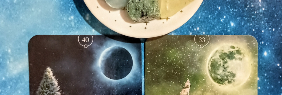 New Beginnings, New Energy: A Message From the Universe, 2 Queen of the Moon Oracle cards and crystals on a starry blue background