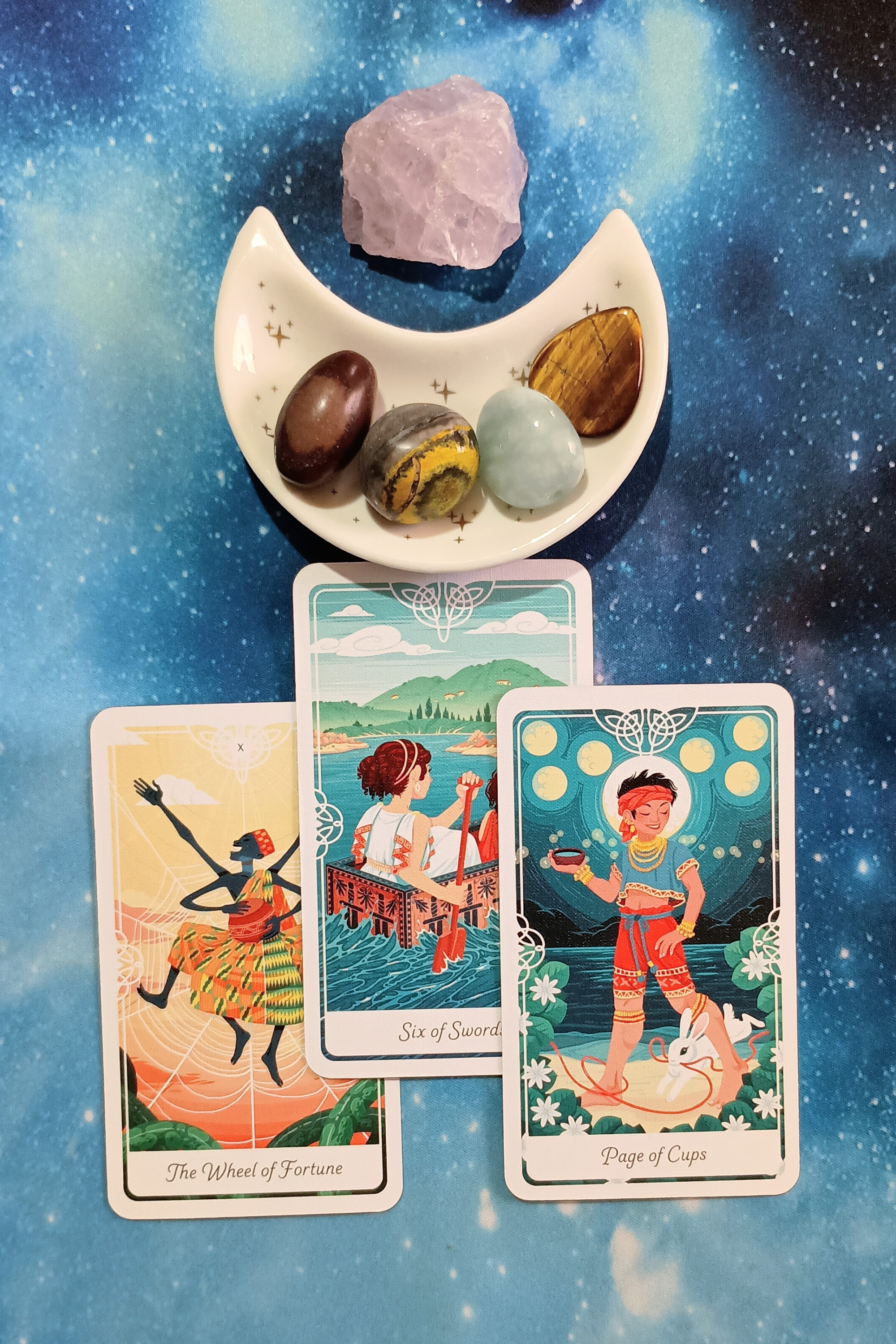 New Timelines, Reframing Anxiety & Excitement: A Message From the Universe, 3 Tarot of the Divine cards and crystals on a starry blue background