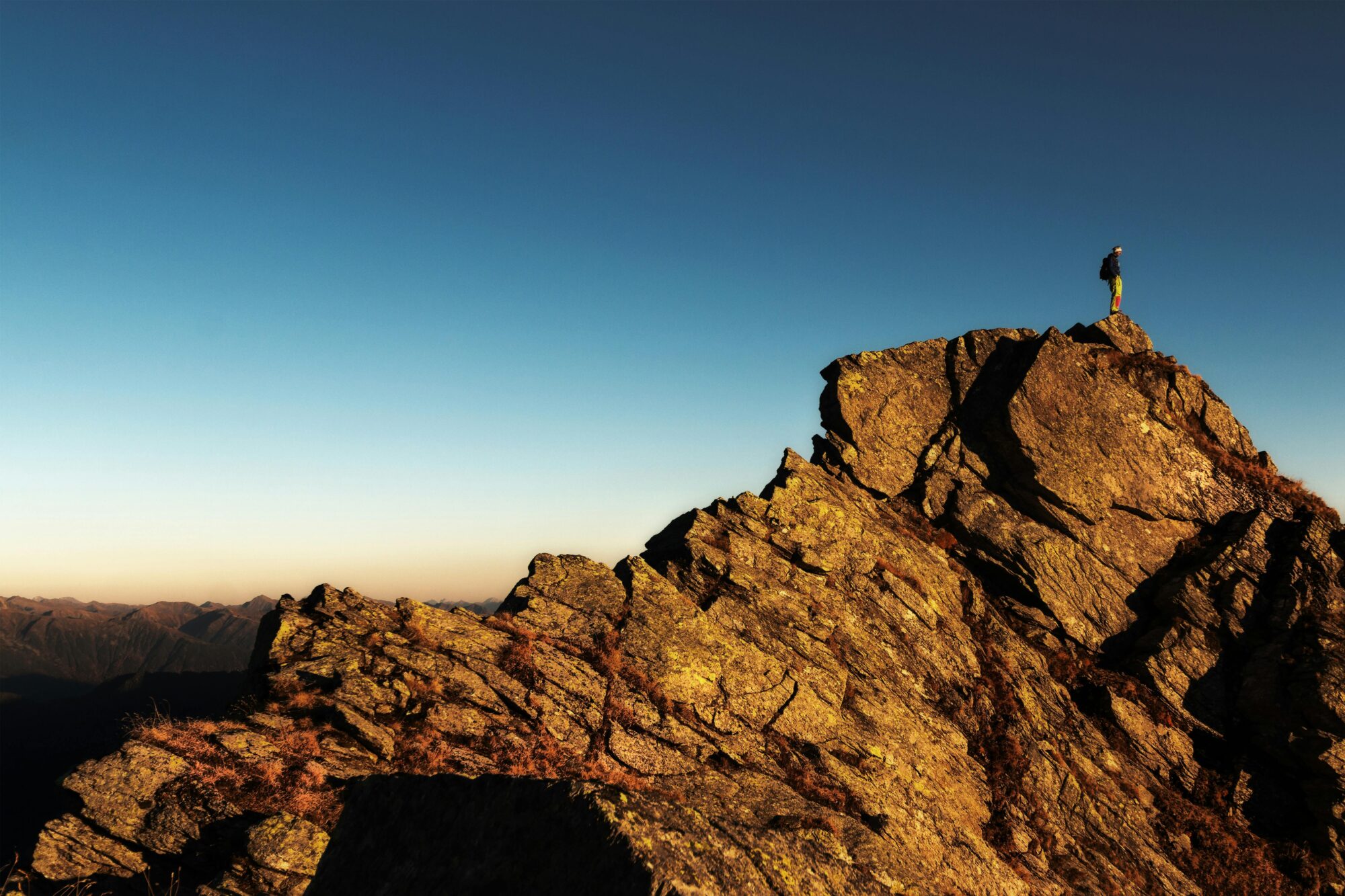 Struggle and Abundance A Message From the Universe, Person on top of a mountain, photo by eberhard grossgasteiger on Pexels,com