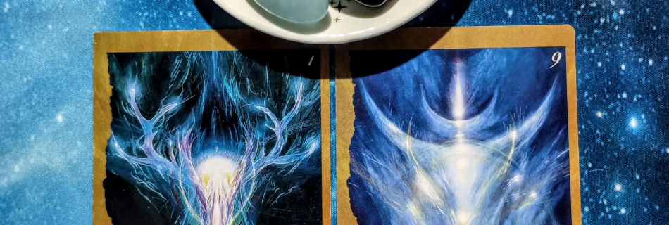 We Are All One: A Message From the Universe, 2 Faeries’ Oracle cards and crystals on a starry blue background