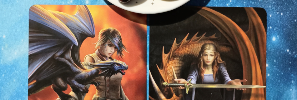 Accepting The Truth: A Message From the Universe, 2 Anne Stokes Gothic Oracle cards and crystals on a starry blue background