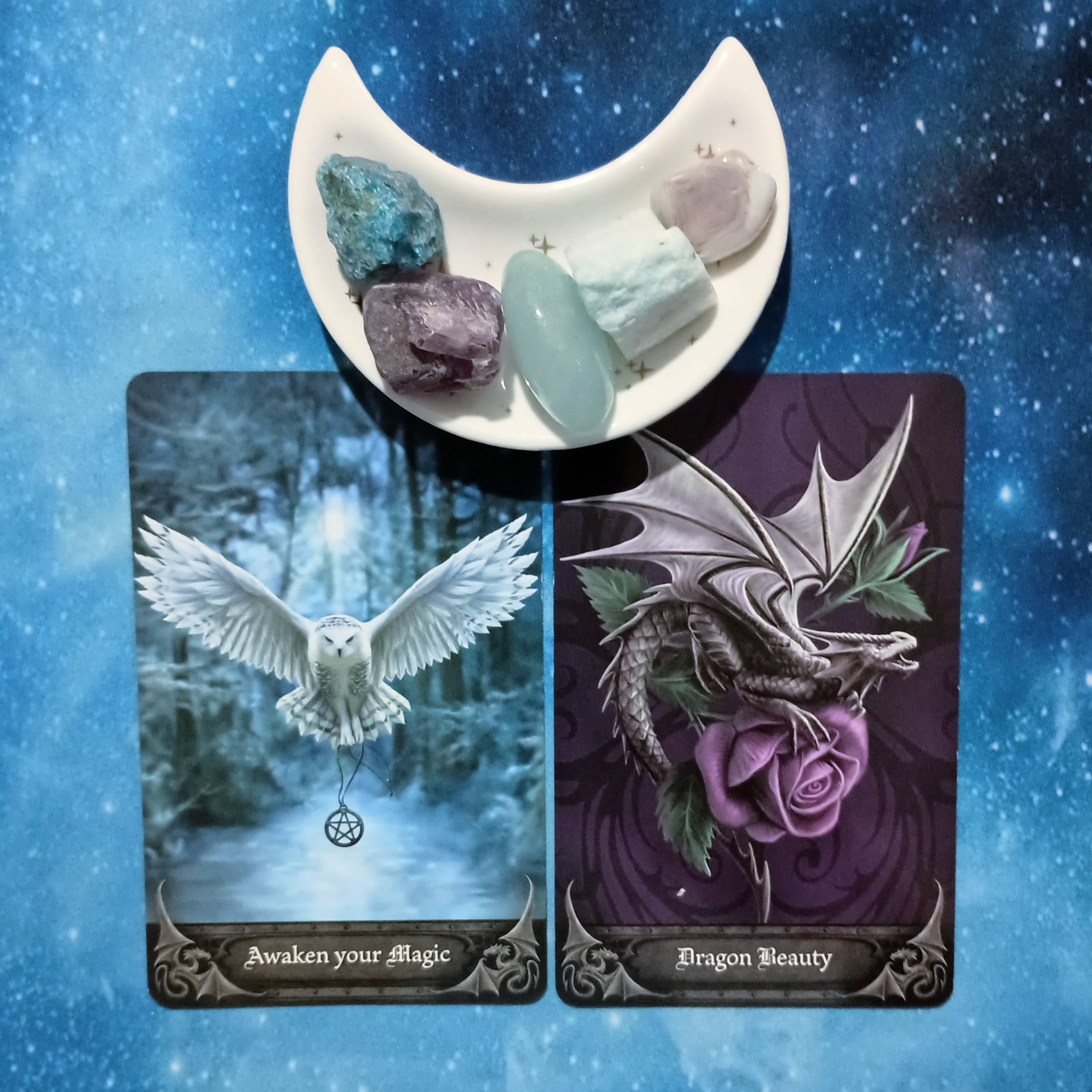 Recognizing Your Own Magic: A Message From the Universe, 2 Anne Stokes Gothic Oracle cards and crystals on a starry blue background