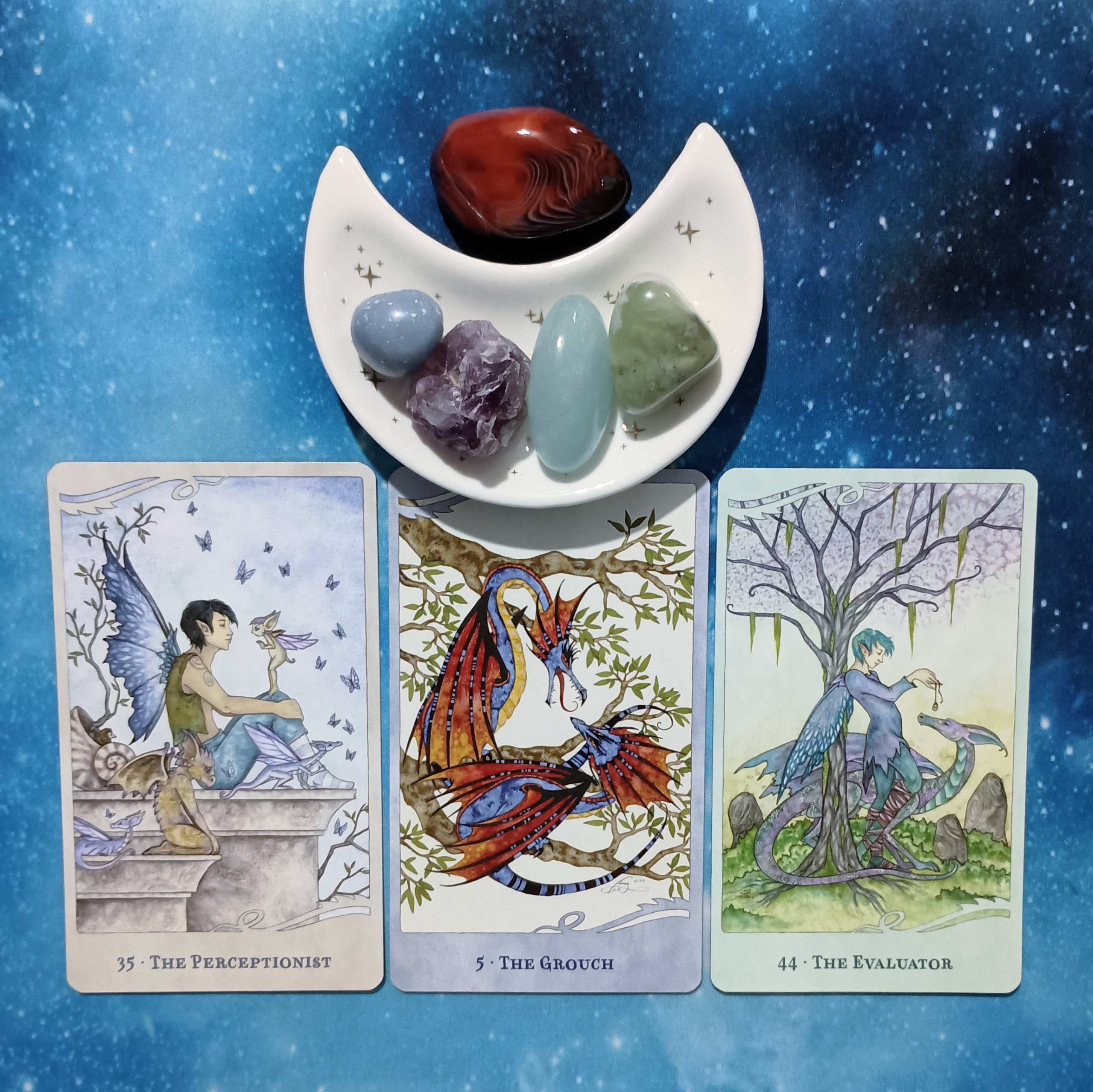 Attitude Adjustment Needed! A Message From the Universe, 3 For the Love of Dragons Oracle cards and crystals on a starry blue background