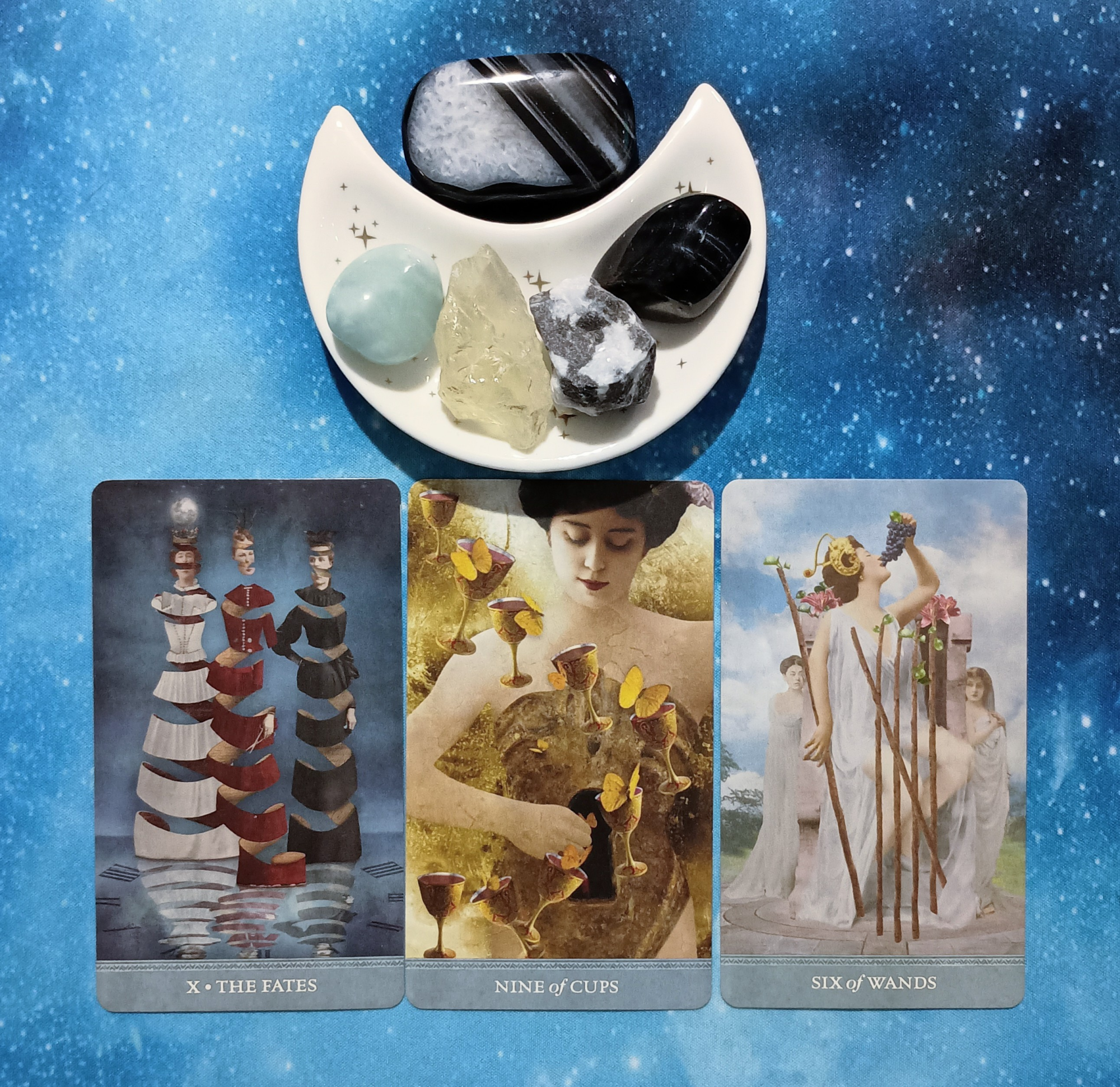 A Season of Expansion: A Message From the Universe, 3 Dreamkeeper’s Tarot cards and crystals on a starry blue background