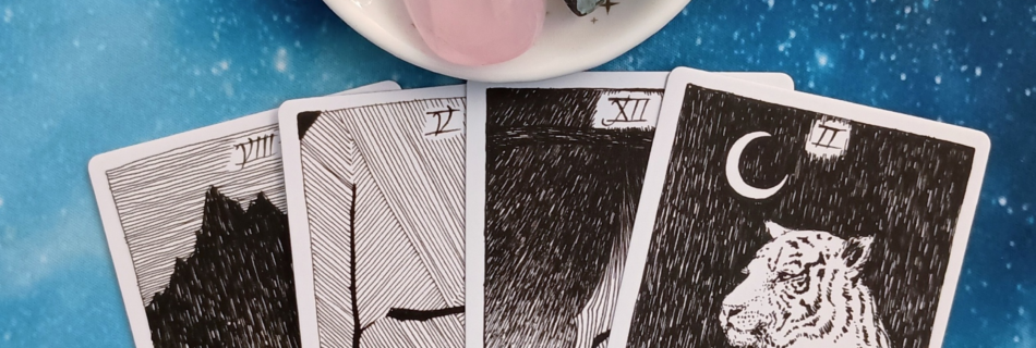 Feeling Stuck? A Message From the Universe, 4 Wild Unknown Tarot cards and crystals on a starry blue background